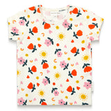 Toddler girl short sleeve t-shirt in Sunny Flower print featuring bright orange flowers, yellow suns, pink hearts, and rainbows on a cream background. Comfortable, stylish, and playful design.