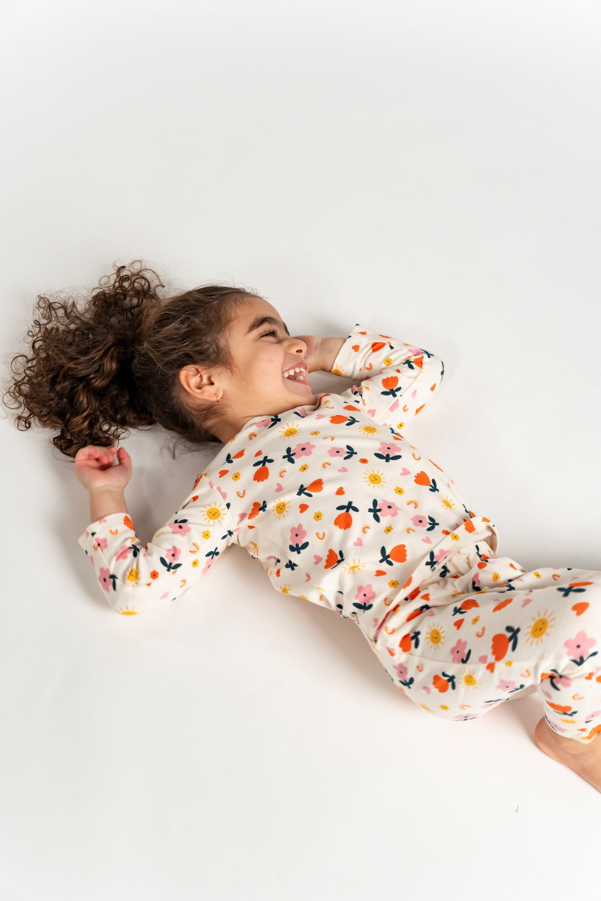 Toddler Girl Slouchy Pants - Sunny Flower Print. Adorable, comfortable, and perfect for active play, featuring a colorful floral and sunshine design.