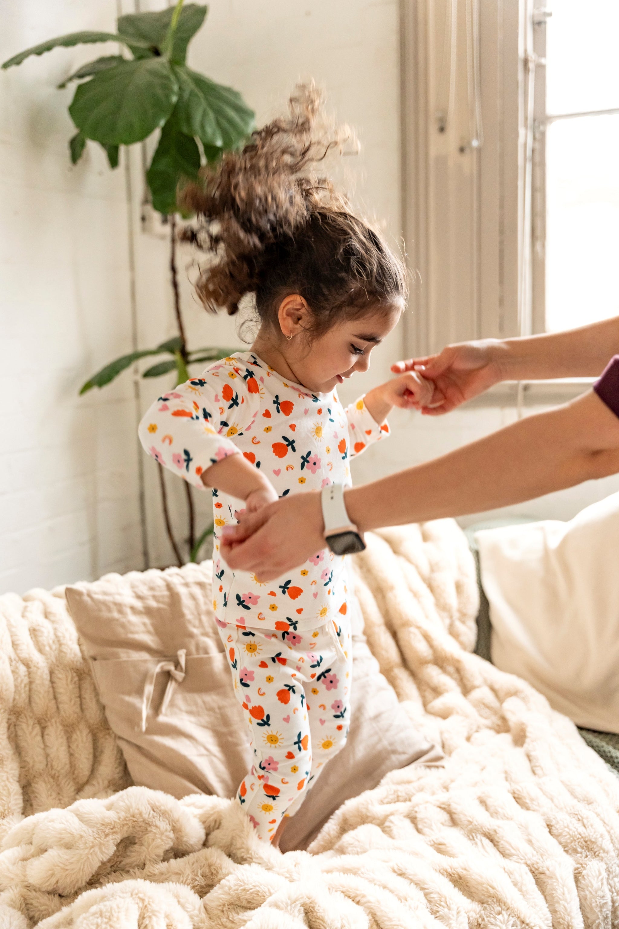 Toddler Girl wearing Long Sleeve T-shirt and pants set in Sunny Flower Print featuring bright sun, flowers, and hearts. Perfect for playful indoor activities, comfort, and casual wear.