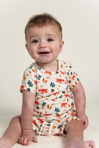 Toddler boy short sleeve t-shirt and slouchy shorts set with playful Fox Forest print featuring orange foxes, acorns, and leaves. Soft cotton fabric, perfect for outdoor adventures and everyday comfort.