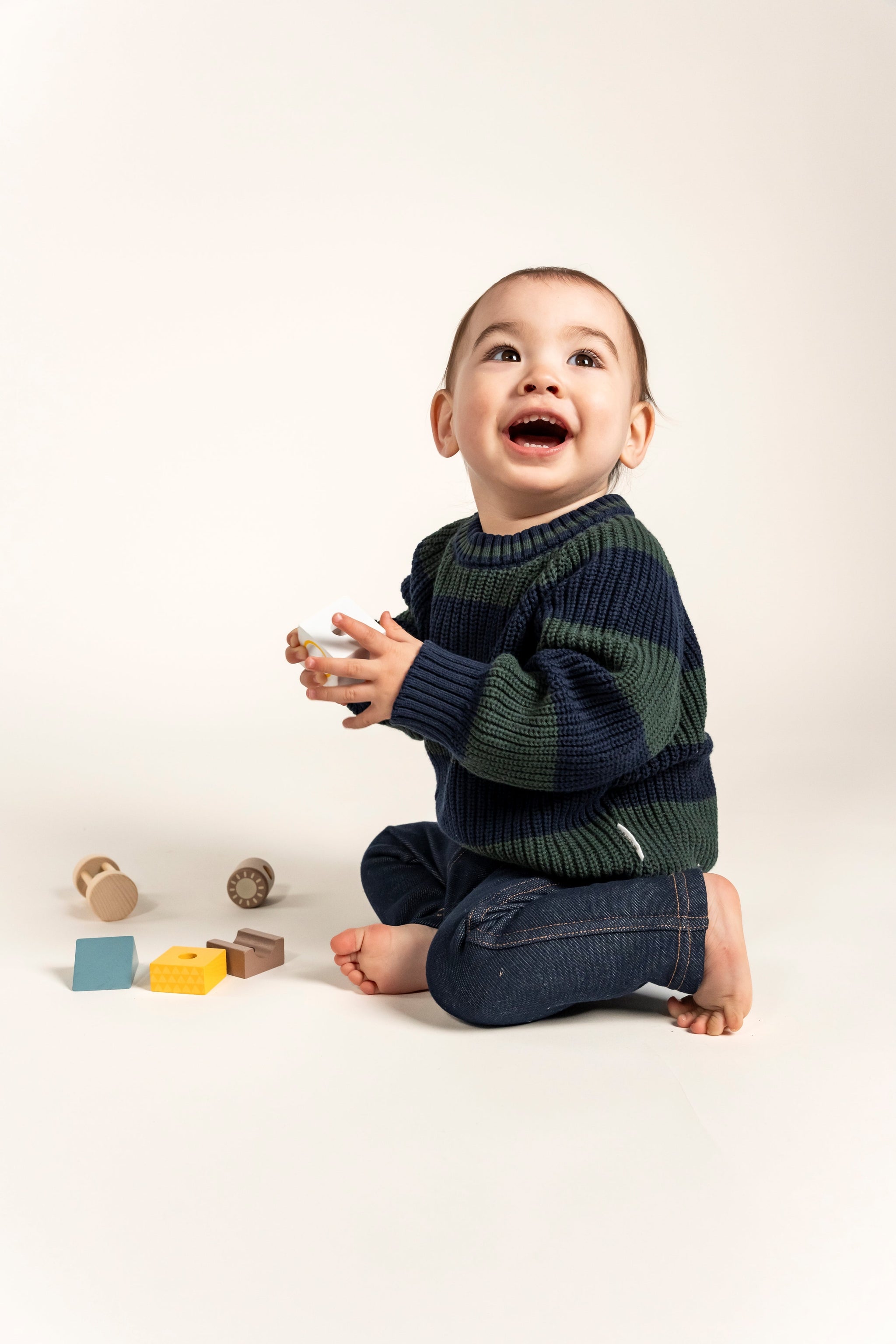 Adorable Navy & Forest Green Striped Knit Jumper for toddlers, featuring a cozy cotton blend perfect for fall and winter layering. Soft, breathable, and stylish for everyday wear, keeping your little one warm.