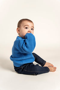 Sky Blue Cotton Knit Jumper for babies, featuring soft, breathable fabric, ribbed cuffs, and a classic crew neck. Perfect for layering, designed for comfort and style in colder months.