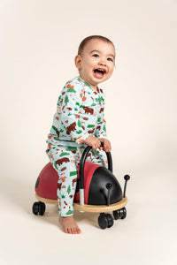 Smiling toddler boy wearing a Long Sleeve T-shirt with a playful Forest Animal Print, featuring bears, foxes, and trees. Perfect for cozy everyday wear. Ideal for outdoor adventures and casual fun.