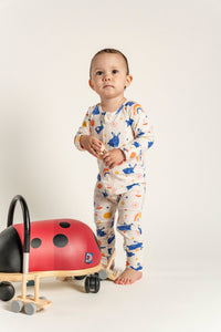 Toddler Girl Long Sleeve Zip Growsuit with adorable Bunnies and Rainbow Print, made from soft, breathable fabric. Features an easy front zipper for quick changes. Perfect for playful, everyday adventures.