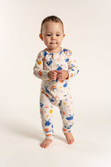 Toddler Girl Long Sleeve Zip Growsuit with cute Bunnies and Rainbow Print, made from soft, breathable fabric. Features a convenient front zipper for easy diaper changes. Perfect for all-day comfort and play.