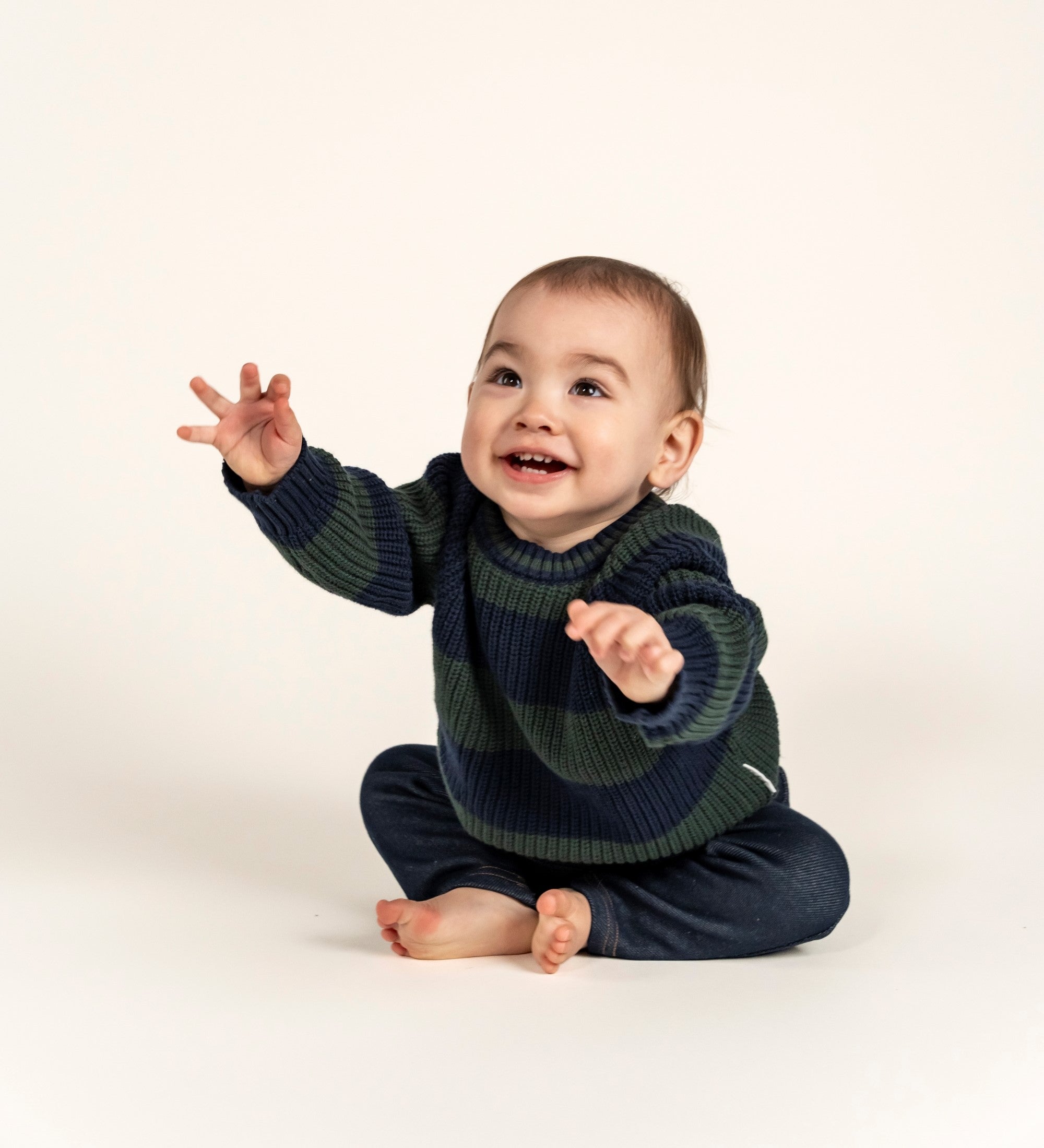 Adorable Navy & Forest Green Striped Knit Jumper crafted from soft cotton, perfect for keeping your little one cozy. Featuring bold stripes and a comfortable fit, ideal for fall and winter layering.