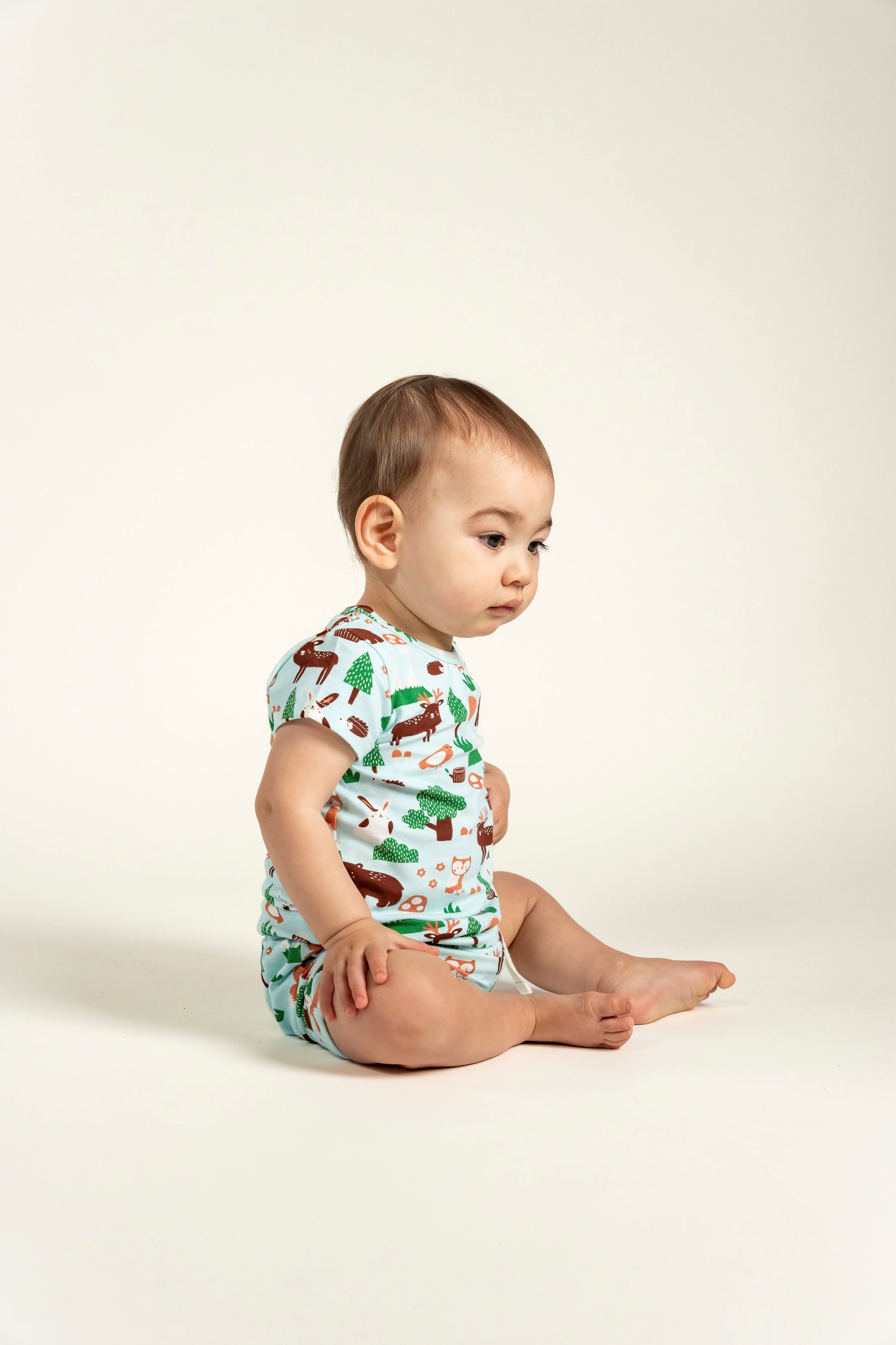 Toddler Boy Slouchy Shorts - Forest Animal Print. Adorable woodland creatures on a soft blue background, perfect for everyday comfort and outdoor adventures.